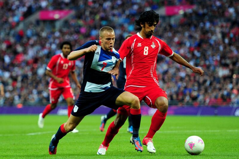 LONDON, ENGLAND - JULY 29:  Tom Cleverley of Great Britain contests for the ball with Hamdan Al-Kamali of United Arab Emirates during the Men's Football first round Group A Match between Great Britain and United Arab Emirates on Day 2 of the London 2012 Olympic Games at Wembley Stadium on July 29, 2012 in London, England.  (Photo by Stu Forster/Getty Images)