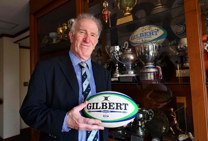 This photo taken on June 25, 2019 shows Mike Galbraith, historian at the Yokohama Country and Athletic Club, posing beside trophies at the club in Yokohama. When 70,000 fans cram into Japan's Yokohama stadium for the Rugby World Cup final in November, few will be aware of the area's rich rugby history which stretches back more than 150 years and includes one of the world's oldest clubs. - TO GO WITH RugbyU-WC-2019-JPN-Japan-Yokohama,FOCUS by Richard Carter
 / AFP / Toshifumi KITAMURA / TO GO WITH RugbyU-WC-2019-JPN-Japan-Yokohama,FOCUS by Richard Carter
