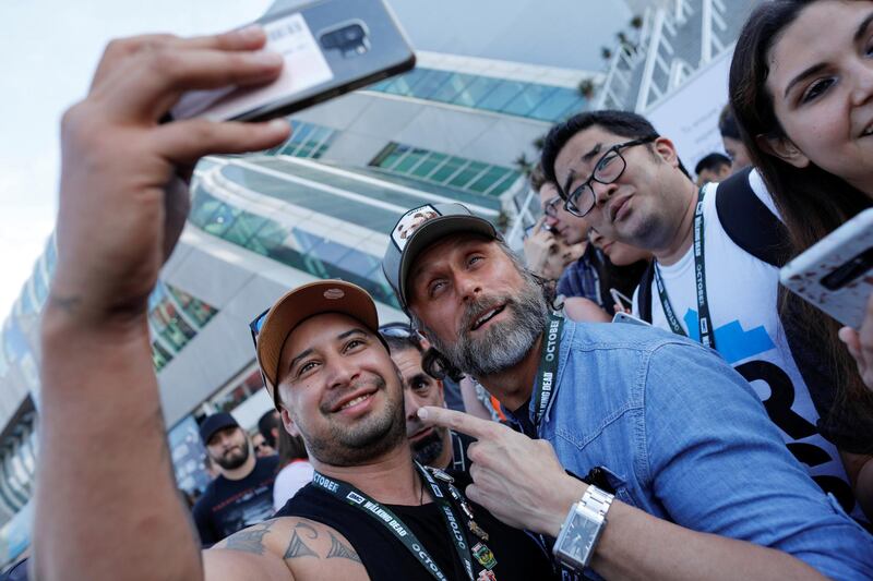 Actor Cecil Garner poses with fans during preview night. Reuters