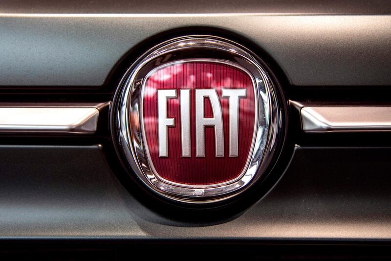 A picture taken on May 27, 2019 at a car dealer in Turin shows the logo of Italian carmaker Fiat, brand of Fiat Chrysler Automobiles (FCA) company. French and Italian-US auto giants Renault and Fiat Chrysler are set to announce talks on an alliance, with a view to a potential merger, informed sources said on May 26, 2019. / AFP / MARCO BERTORELLO
