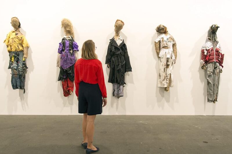 A visitor looks at the art installation The Soiled Puppets of Pommern (2014) by Belgian artists Jos de Gruyter and Harald Thys, represented by the galleries Isabella Bortolozzi (Berlin) and Micheline Szwajcer (Bruxelles), on display during the exhibition Unlimited. Georgios Kefalas / EPA