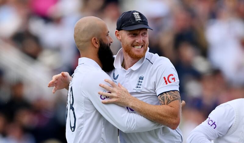 Moeen Ali of England celebrates with Ben Stokes after taking the wicket of Travis Head. Getty