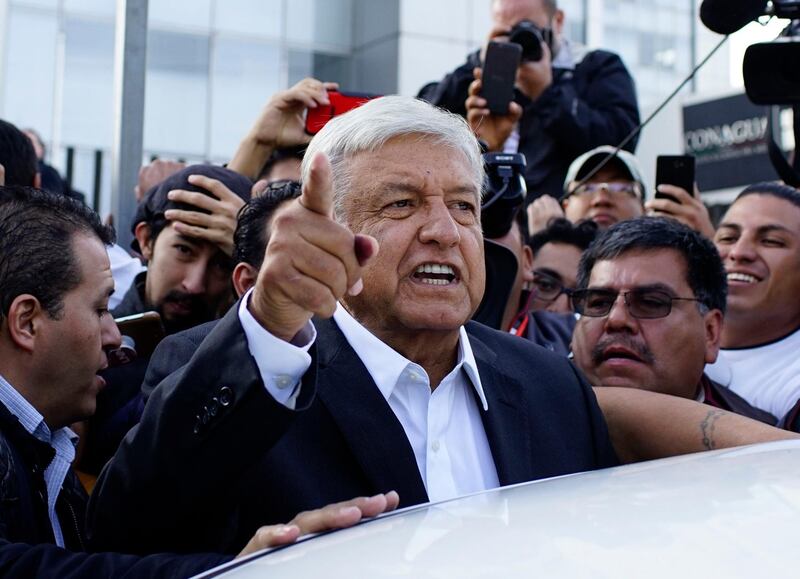 Presidential candidate Andres Manuel Lopez Obrador talks to reporters as he departs after casting his ballot at a polling station during the presidential election in Mexico City, Mexico, July 1, 2018. REUTERS/Alexandre Meneghini