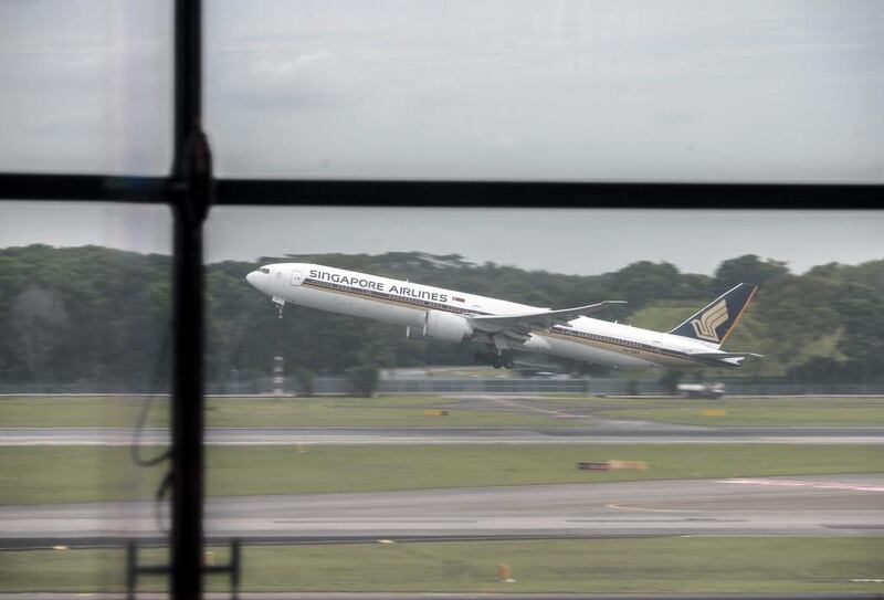 A Singapore Airlines Boeing 777 takes off from Changi airport in Singapore. The WTO has ruled the plane maker gained unlawful subsidies over its next generation of the superjumbo, the 777X. Wallace Woon / EPA