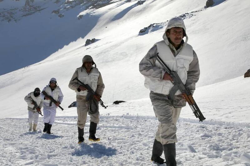 A handout picture released by the official Syrian Arab News Agency shows Syrian army soldiers holding their positions at the snow-covered Jabal al-Sheikh, also known as Mount Hermon, in the Golan Heights on the border with Lebanon and Israel.  AFP