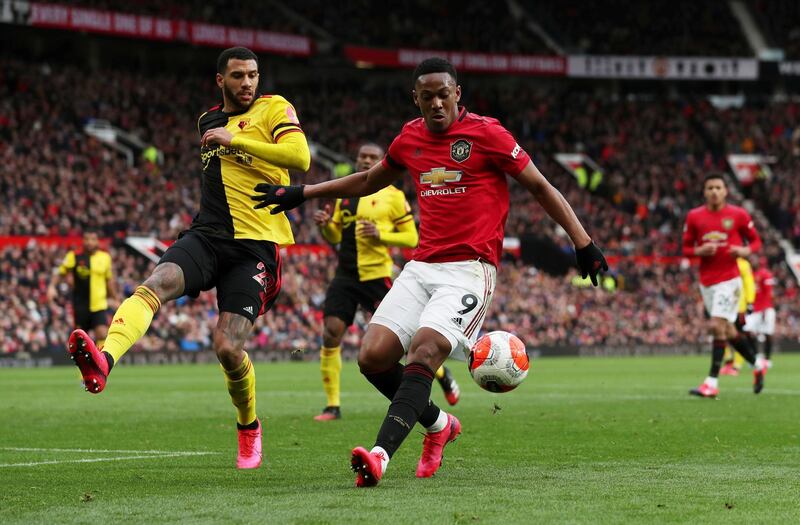 Manchester United's Anthony Martial takes on Watford's Etienne Capoue. Reuters