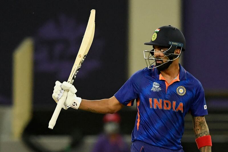 KL Rahul raises his bat after scoring a half-century against Namibia. AFP