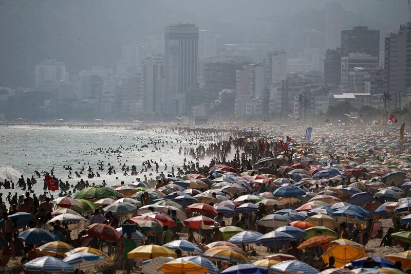 People crowd Ipanema beach on a sunny and hot summer day in Rio de Janeiro, Brazil. EPA