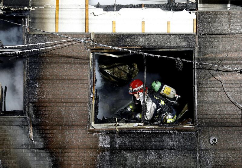 A firefighter inspects a facility  to support senior people on welfare, where a fire occurred, in Sapporo, Japan, in this photo taken February 1, 2018. Kyodo / via Reuters
