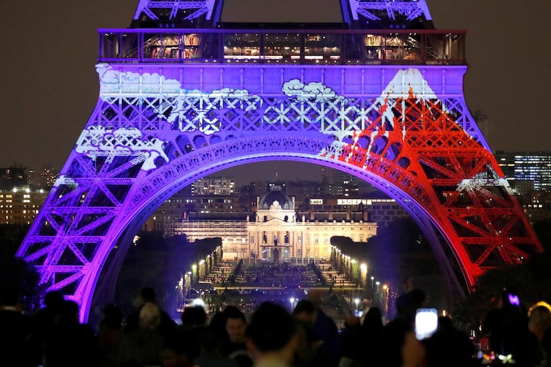 Lighting designers Motoko Ishii and Akari-Lisa Ishii present a two-day special light show on the Eiffel Tower to celebrate the Japanese cultural season and 160 years of diplomatic relations between France and Japan in Paris. Charles Platiau / Reuters