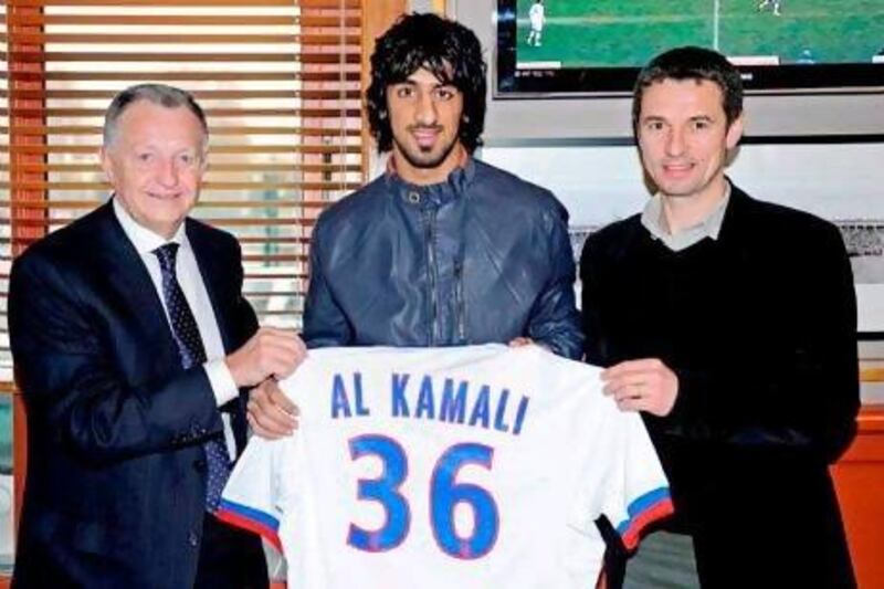 Hamdan Al Kamali, centre, flanked by Jean-Michel Aulas, left, the Lyon president, and Remi Garde, the first-team coach, after finalising his loan move to France earlier this year. Courtesy of Al Ittihad