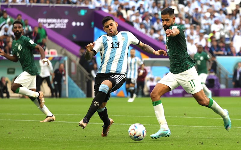 Saleh Al Shehri, right, scores his team's opening goal. EPA