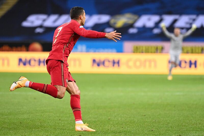 Portugal's forward Cristiano Ronaldo celebrates scoring the opening goal, his 100th goal for Portugal, during the UEFA Nations League football match between Sweden and Portugal on September 8, 2020 in Solna, Sweden. (Photo by Jonathan NACKSTRAND / AFP)