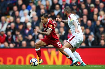 LIVERPOOL, ENGLAND - SEPTEMBER 16: Philippe Coutinho of Liverpool attempts to get past Steven Defour of Burnley during the Premier League match between Liverpool and Burnley at Anfield on September 16, 2017 in Liverpool, England.  (Photo by Alex Livesey/Getty Images)