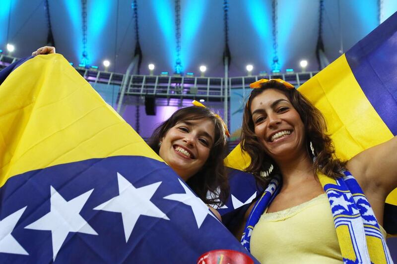 Bosnia and Herzegovina fans wave flags at the Maracana. Ronald Martinez / Getty Images