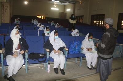 epa08945890 Students wearing face masks and maintain social distance as they attend lectures on the first day of school after the resumption of classes of higher grades in Hyderabad, Pakistan, 18 January 2021. The Pakistani government, on 18 January, reopened educational institutions to resume 9th to 12th classes as part of a phased reopening of schools. Pre-primary and primary classes are scheduled to resume on 01 February as cases of COVID-19 infections continue to decline in the country.  EPA/NADEEM KHAWER