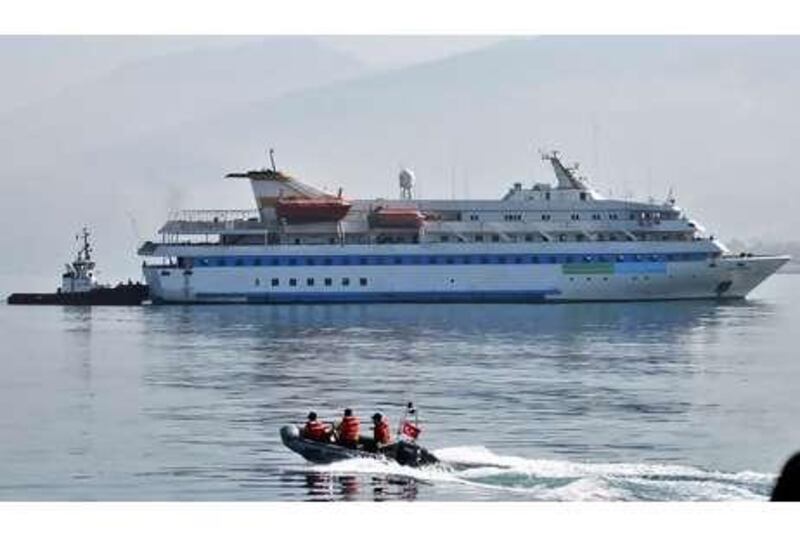 The <i>Mavi Marmara</i> is towed by a Turkish tugboat into Iskenderun port in the southern city of Hatay, Turkey, last week.