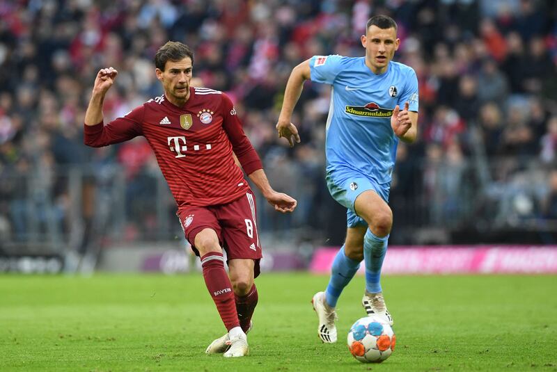 Bayern Munich midfielder Leon Goretzka and Freiburg's Maximilian Eggestein vie for the ball. AFP
