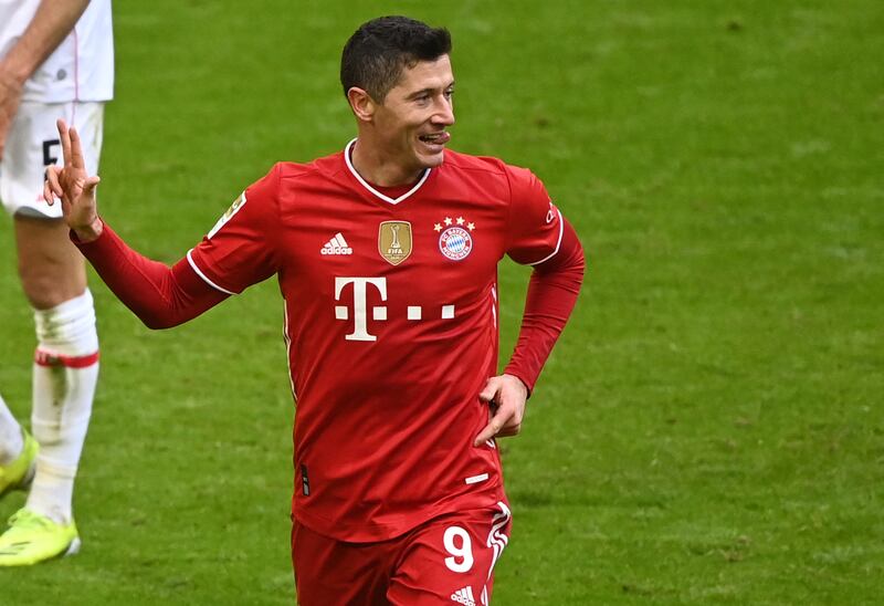 Bayern forward Robert Lewandowski celebrates completing his first-half hat-trick. AFP