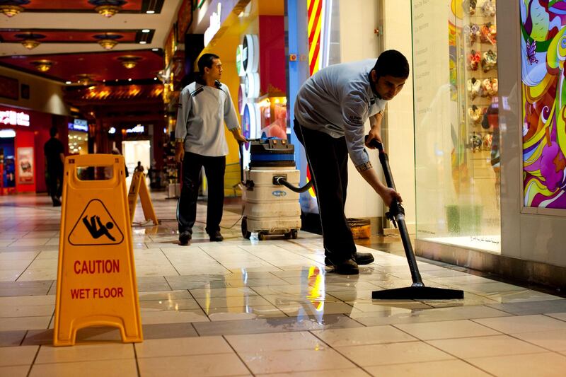 Dubai, United Arab Emirates, April 7, 2013:    Crews work to clean up water that was leaking through the roof after heavy rain at Ibn Battua Mall in Dubai on April 7, 2013. Christopher Pike / The National