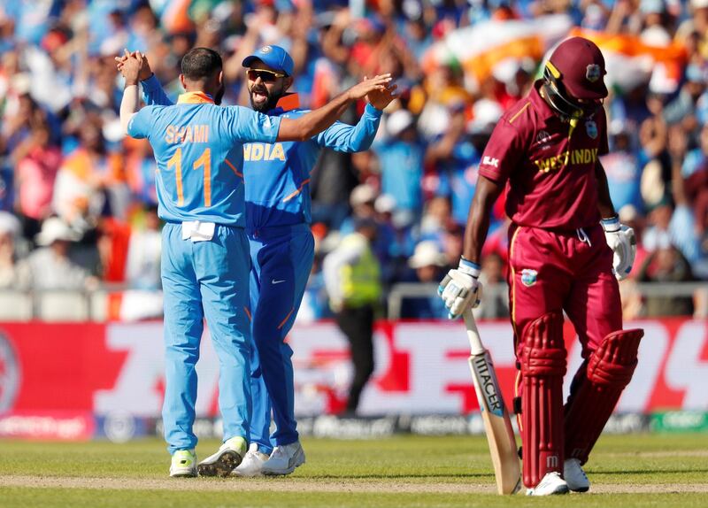 Cricket - ICC Cricket World Cup - West Indies v India - Old Trafford, Manchester, Britain - June 27, 2019   India's Mohammed Shami celebrates with Virat Kohli after taking the wicket of West Indies' Shimron Hetmyer    Action Images via Reuters/Lee Smith