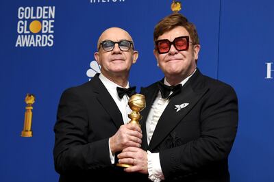 epa08106195 Bernie Taupin (L) and Elton John, winners for the award for Best Original Song - Motion Picture for "I'm Gonna Love Me Again" from "Rocketman" in the press room during the 77th annual Golden Globe Awards ceremony at the Beverly Hilton Hotel, in Beverly Hills, California, USA, 05 January 2020.  EPA/CHRISTIAN MONTERROSA