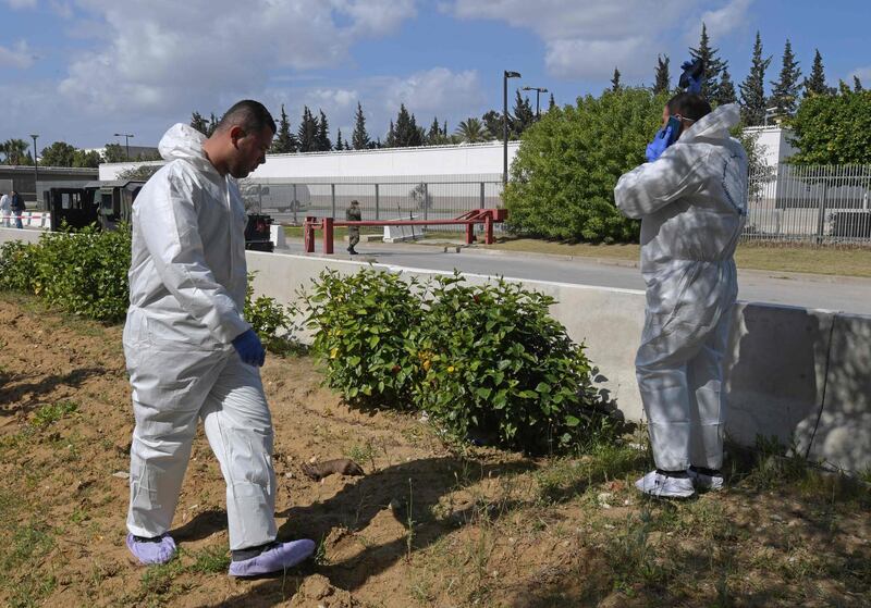 Forensic experts inspect the scene of an explosion near the US embassy in the Tunisian capital Tunis. AFP