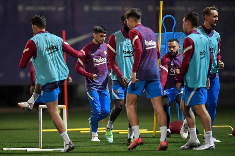 Barcelona's Spanish midfielder Pedri and teammates take part in a training session. AFP