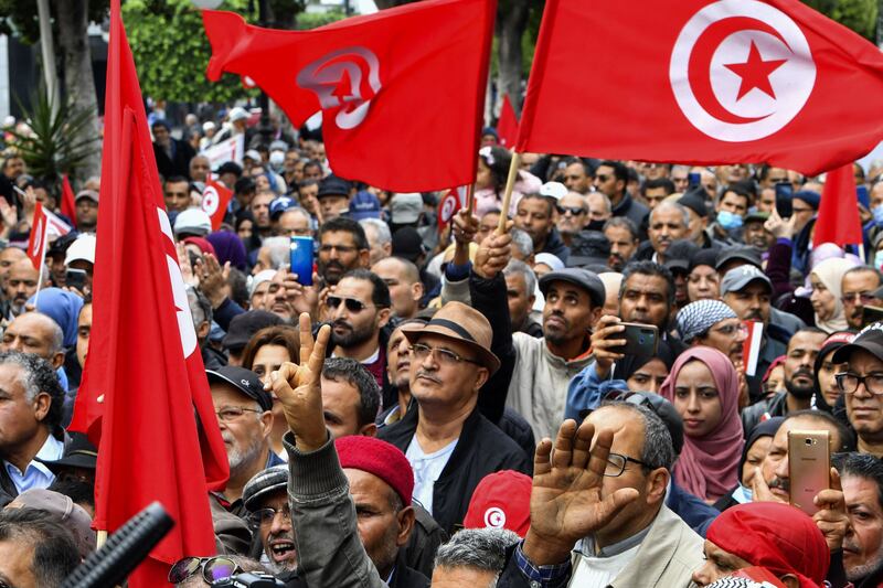 Demonstrators take part in a rally in Tunis called for by the opposition National Salvation Front against President Kais Saied. AFP