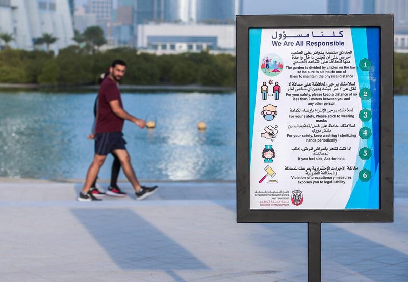 Abu Dhabi, United Arab Emirates, July 10, 2020.   
 A Covid-19 sign along Reem Beach reminds residents exercising to be responsible.
Victor Besa  / The National
Section:  Standalone
Reporter: