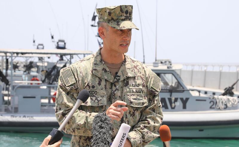 Commander Sean Kido, Commanding Officer of Task Group 56.1, speaks during a press briefing at a UAE Naval facility near the port of Fujairah. AFP