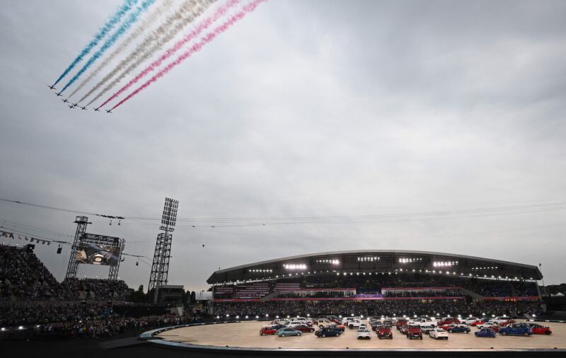 The Red Arrows, the Aerobatic Team of Britain's Royal Air Force, fly over the stadium. AFP
