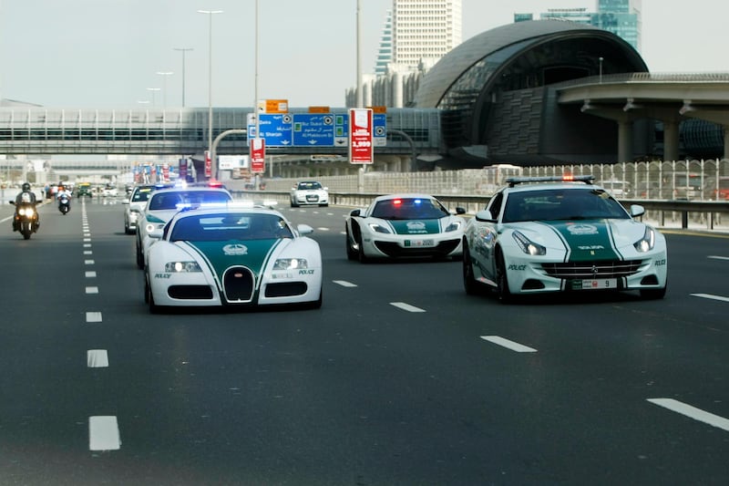 Dubai, United Arab Emirates, February 8, 2014:      Police super cars drive ahead of cyclists during the fourth stage of the Dubai Tour cycling race in Dubai on February 8, 2014. Christopher Pike / The National

Reporter: Paul Radley
Section: Sport