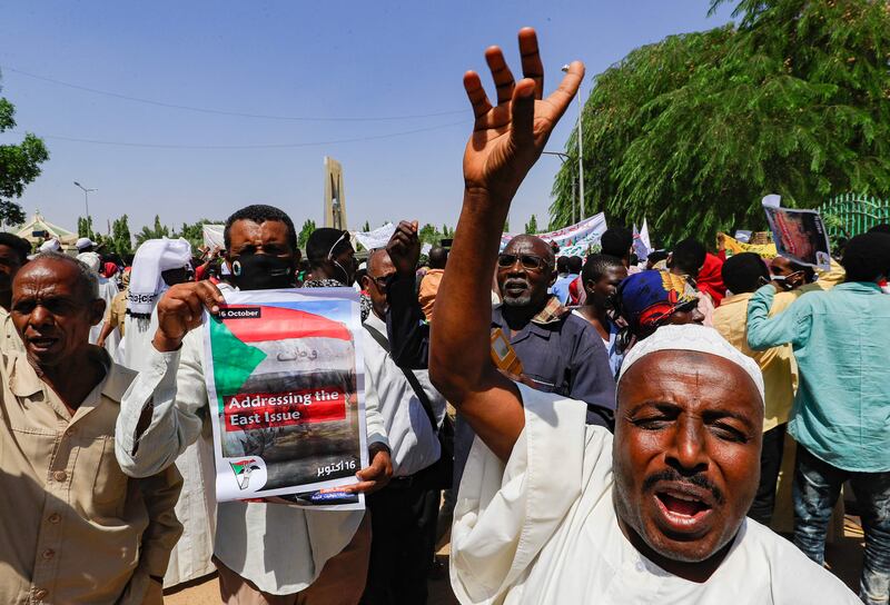 Sudanese protesters outside the presidential palace in Khartoum. AFP