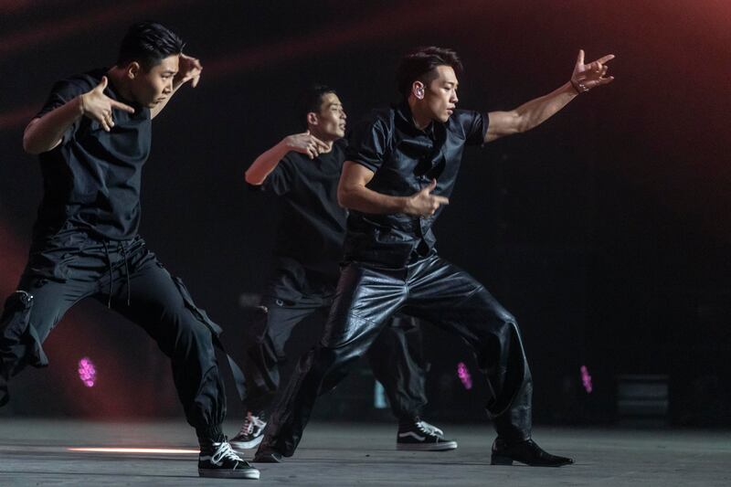Rain performing with his backing dancers. 