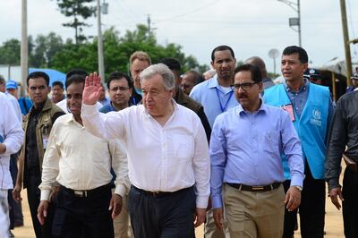 UN Secretary General Antonio Guterres (C) arrives at the Kutupalong refugee camp during his visit to the Rohingya community in Bangladesh's southeastern border district of Cox's Bazar on July 2, 2018.
UN Secretary General Antonio Guterres said he heard "unimaginable" accounts of atrocities during a visit July 2 to vast camps in Bangladesh that are home to a million Rohingya refugees who fled violence in Myanmar. / AFP PHOTO / MUNIR UZ ZAMAN