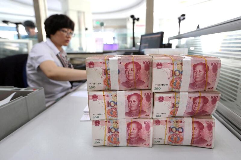 China’s central bank on Tuesday set the official value of the yuan nearly 2 per cent lower against the US dollar. AFP

