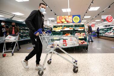 A customer pushes a shopping cart at a Tesco supermarket in Hatfield, Britain. Around 80% of imported food sold in supermarkets comes from the EU. According to the British Retail Consortium, the industry body. Reuters