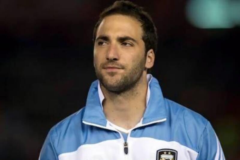 Napoli supporters mob Argentine player Gonzalo Higuain upon his arrival in Rome.