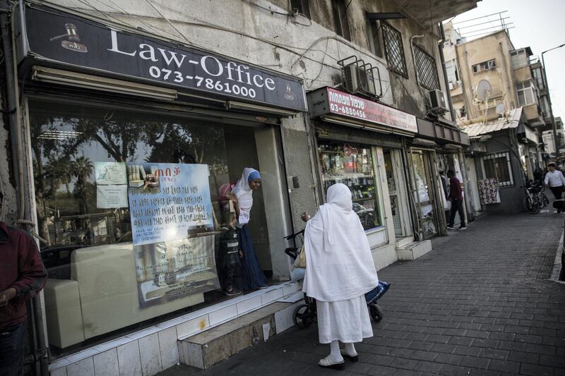 Eritrean asylum seekers at a law office that deals with visa issues and other problems facing migrant workers   in south Tel Aviv on March 19,2018.The Israeli government is trying to carry out a plan to expel over 38,000 African migrants currently living in Israel.(Photo by Heidi Levine for The National).