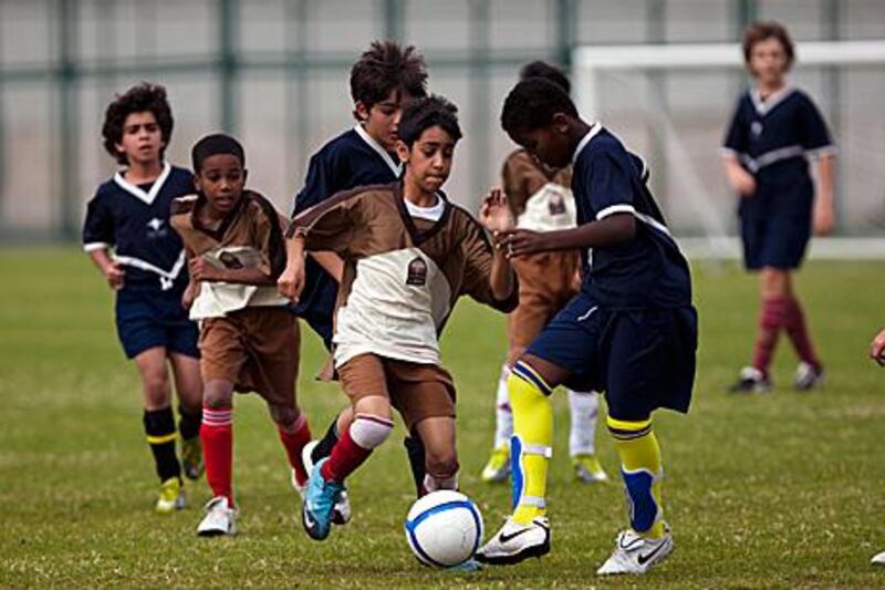 Al Muna Primary School, in brown, face Pearl Primary School at Al Jazira.