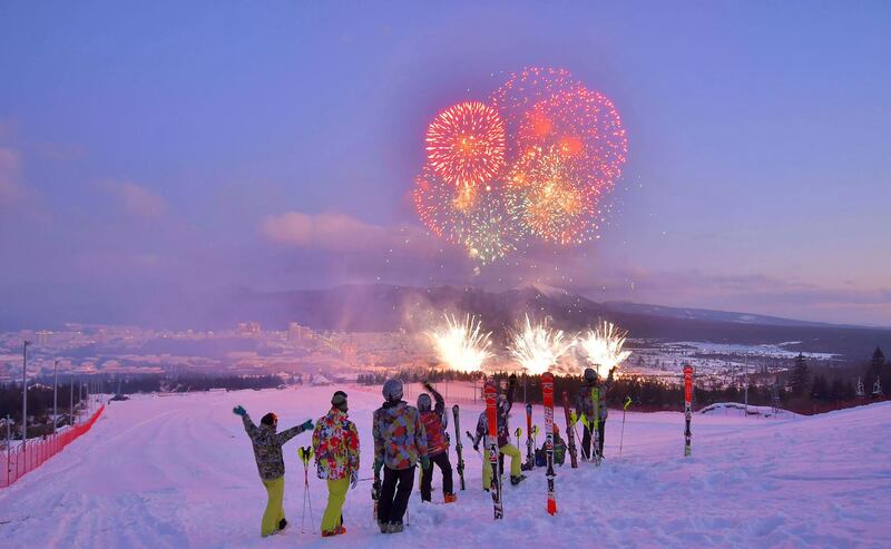 Skiers watching fireworks during a ceremony to mark the completion of the construction of the township of Samjiyon County.  AFP