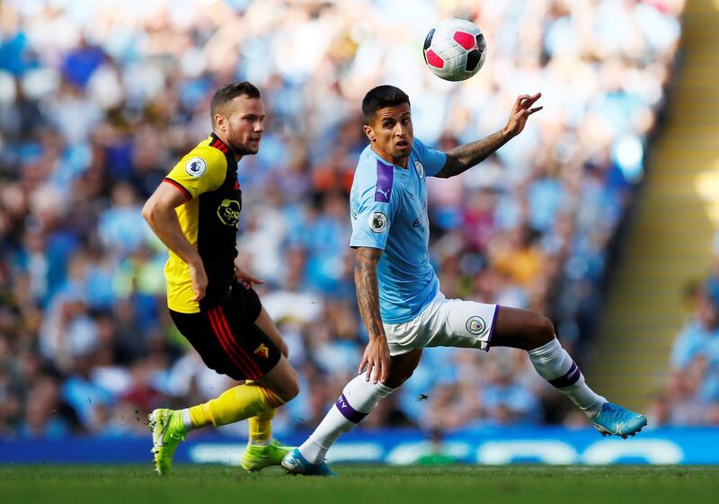 Soccer Football - Premier League - Manchester City v Watford - Etihad Stadium, Manchester, Britain - September 21, 2019  Manchester City's Joao Cancelo in action with Watford's Tom Cleverley   Action Images via Reuters/Jason Cairnduff  EDITORIAL USE ONLY. No use with unauthorized audio, video, data, fixture lists, club/league logos or "live" services. Online in-match use limited to 75 images, no video emulation. No use in betting, games or single club/league/player publications.  Please contact your account representative for further details.
