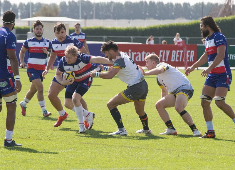 Dubai Hurricane (grey/white shirts) take on Jebel Ali Dragons at The Sevens Stadium in Dubai. Ruel Pableo for The National