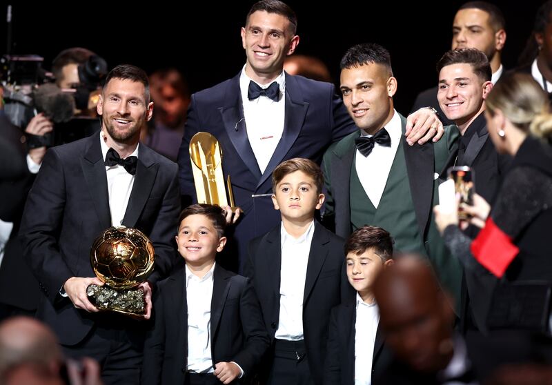 Messi with his three sons and his Argentina teammates Emiliano Martinez, Lautaro Martinez and Julian Alvarez. EPA