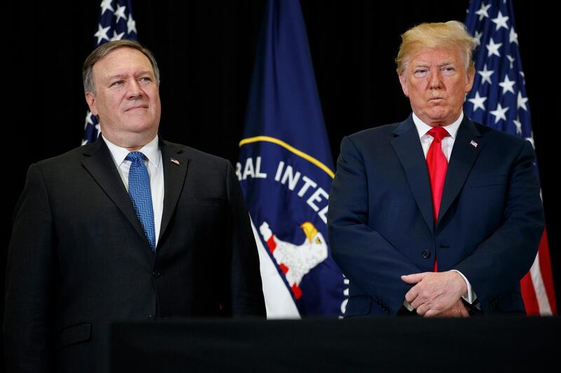 President Donald Trump stands with Secretary of State Mike Pompeo during a swearing-in ceremony for incoming Central Intelligence Agency director Gina Haspel at CIA Headquarters, Monday, May 21, 2018, in Langley, Va. (AP Photo/Evan Vucci)