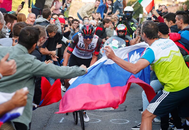 Fans's cheer on Tadej Pogacar in the Giro di Lombardia. AFP