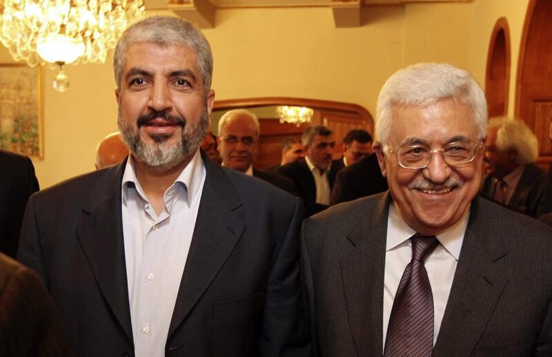 Palestinian Hamas leader Khaled Mashaal, left, and Palestinian president Mahmoud Abbas during their meeting in Cairo. Office of Khaled Meshaal / AP Photo