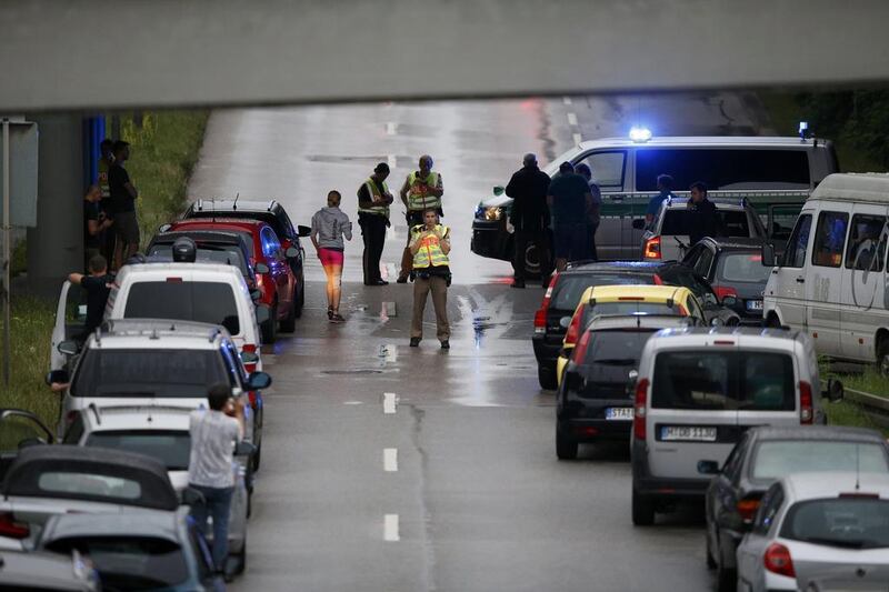 German police halt traffic on a road near the scene of a shooting rampage at Munich’s Olympia shopping mall on July 22, 2016. Michael Dalder / Reuters