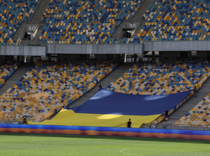 A Ukrainian flag is seen at the NSC Olimpiyskiy stadium.